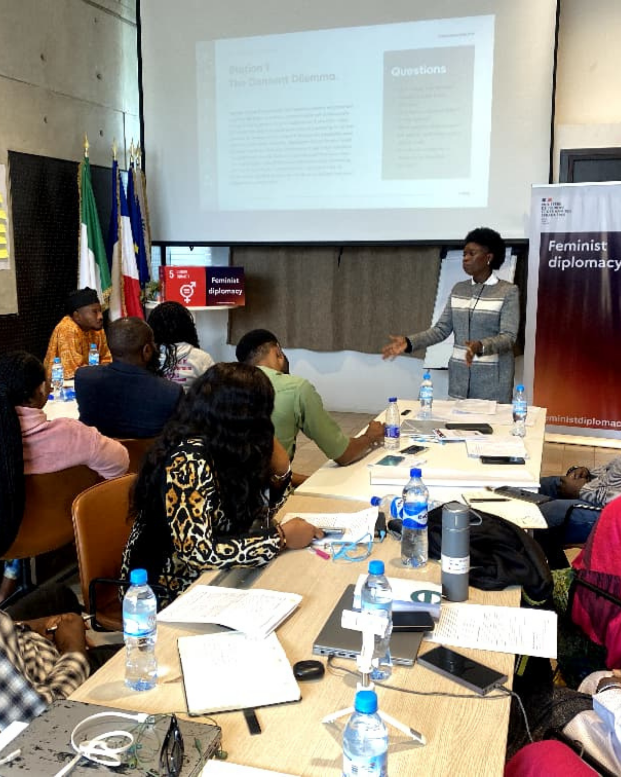 A picture of Mofoyeke Omole at the French Embassy Facilitating a training program for the French Government Grantees
